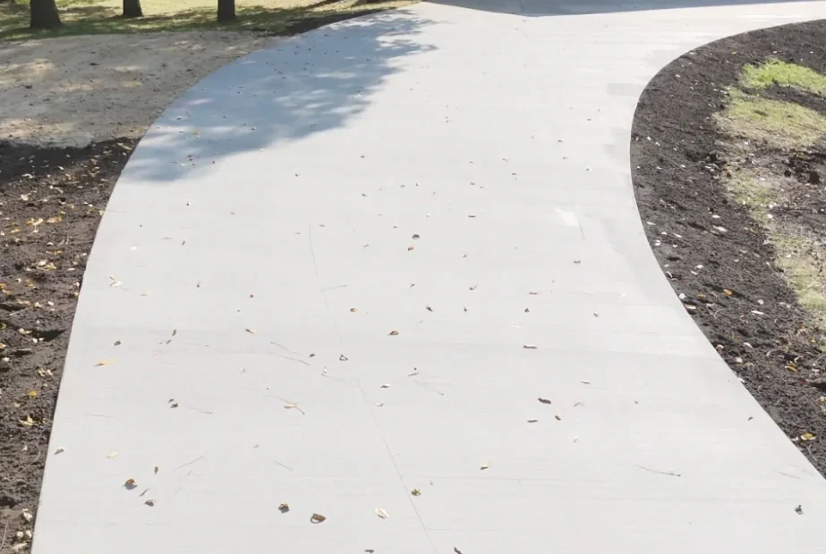 Long concrete driveway leading to a detached garage in southern Minnesota