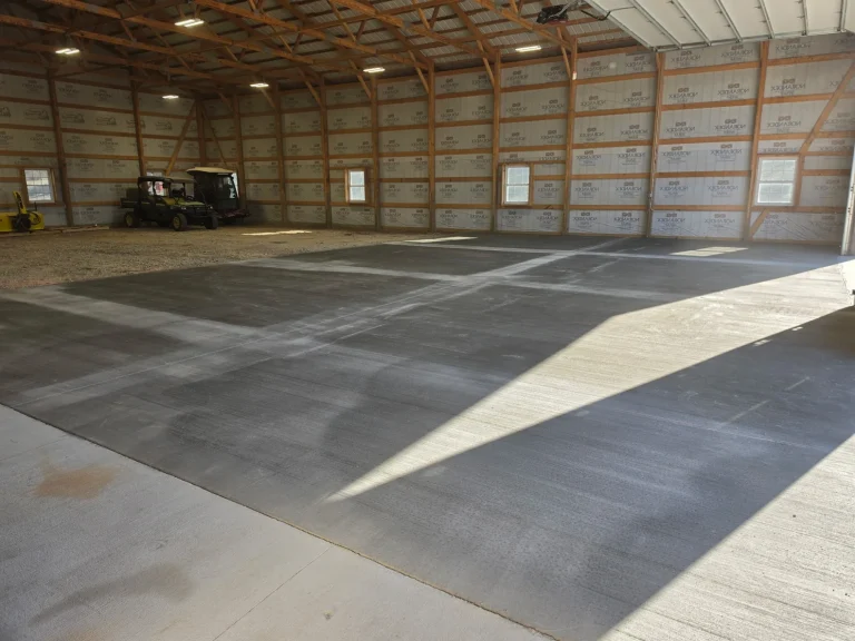 Pole barn interior with freshly poured concrete slab in southern Minnesota